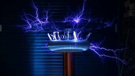Electricity flowing around a silver coil